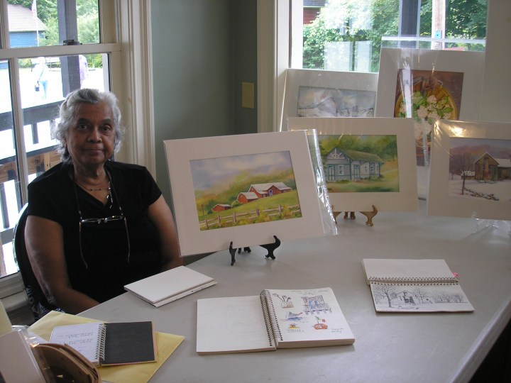 Oneida Hammond with her watercolors and sketchbooks
